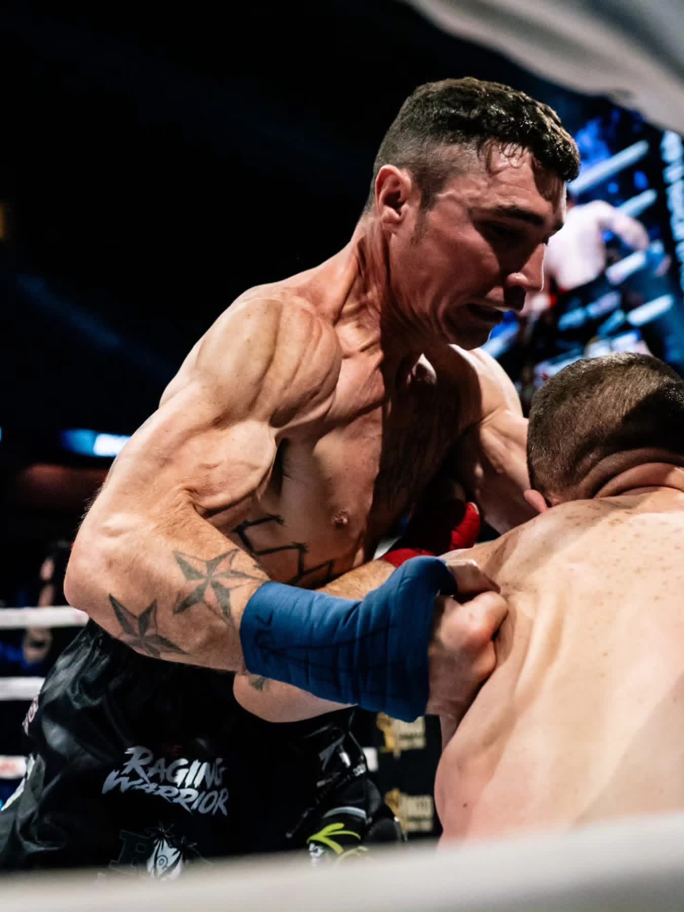 Joey Gambino fighting in close against his opponent