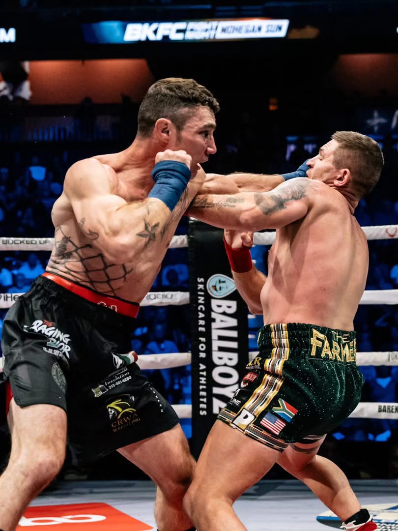 Joey Gambino landing a straight punch on Tommy Strydom