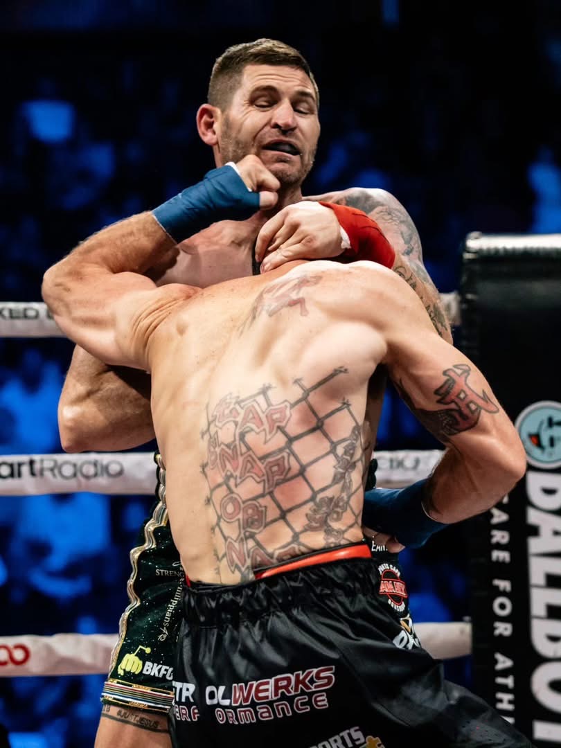 Joey Gambino throwing an uppercut in close quarters