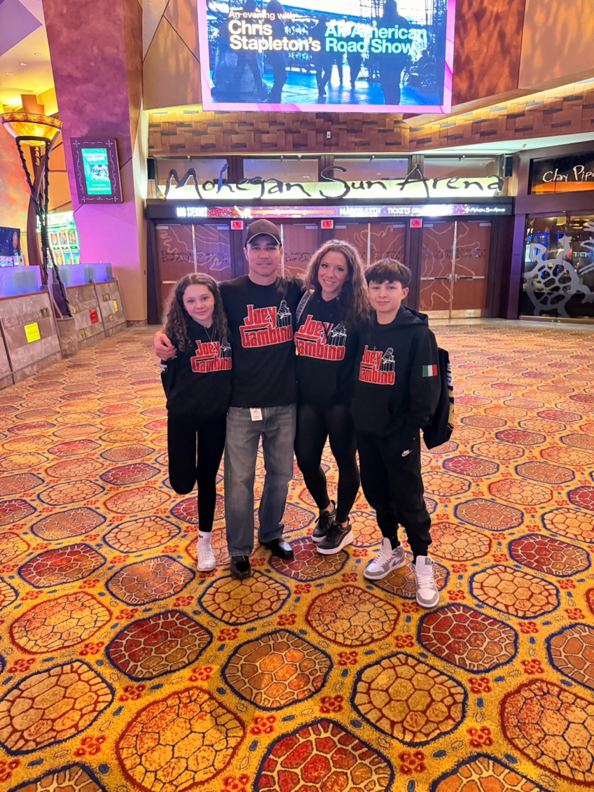 Joey Gambino with his wife and two children at Mohegan Sun Arena